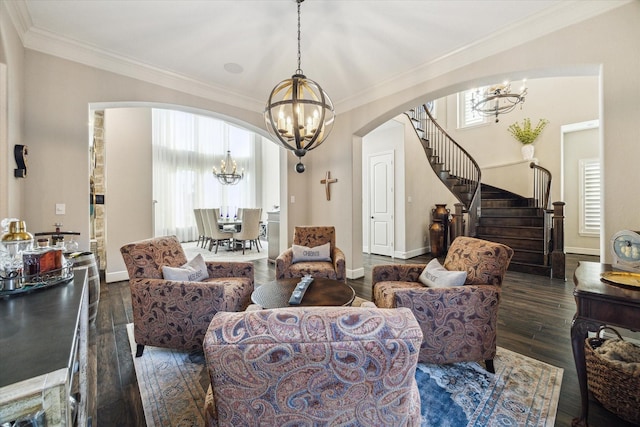 13627 Saddlebred Springs Ln, Cypress, TX 77429 - living area with a chandelier, arched walkways, hardwood / wood-style flooring, crown molding, and stairway