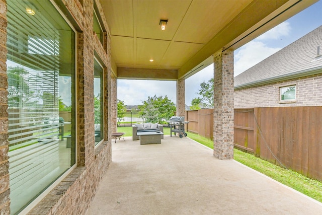 10119 Napier Dr, Iowa Colony, TX 77583 - fenced backyard featuring a patio area, an outdoor hangout area, and grilling area