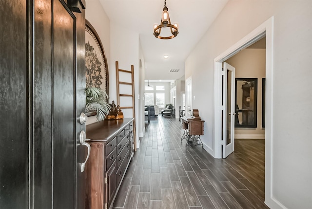 10119 Napier Dr, Iowa Colony, TX 77583 - entryway featuring dark wood finished floors and a chandelier