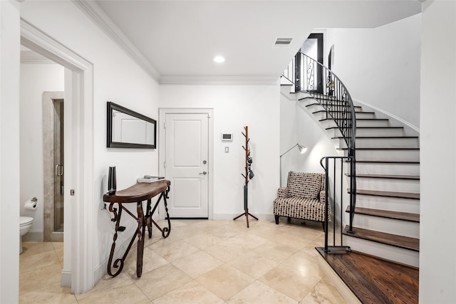 1616 Nevada St, Houston, TX 77006 - entryway with ornamental molding, stairway, light tile patterned floors, and recessed lighting