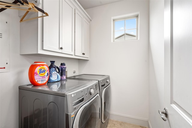 1616 Nevada St, Houston, TX 77006 - laundry area with washer and clothes dryer, cabinet space, and light tile patterned floors