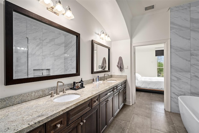 1616 Nevada St, Houston, TX 77006 - ensuite bathroom with double vanity and a freestanding bath