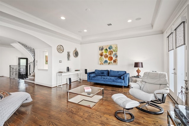 1616 Nevada St, Houston, TX 77006 - living area featuring a raised ceiling, wood finished floors, stairway, crown molding, and arched walkways