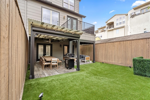1616 Nevada St, Houston, TX 77006 - rear view of house with a balcony, a patio area, a fenced backyard, and ceiling fan
