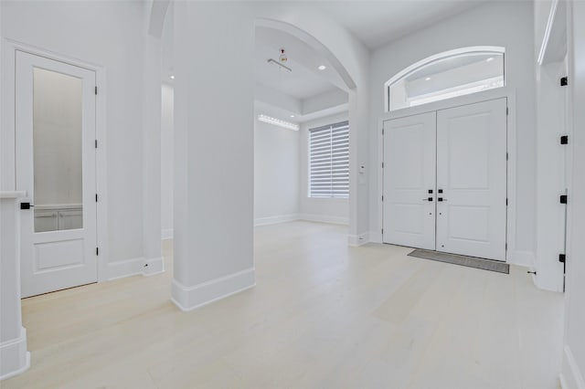 2822 Westgrove Ln, Houston, TX 77027 - foyer entrance with arched walkways and wood finished floors