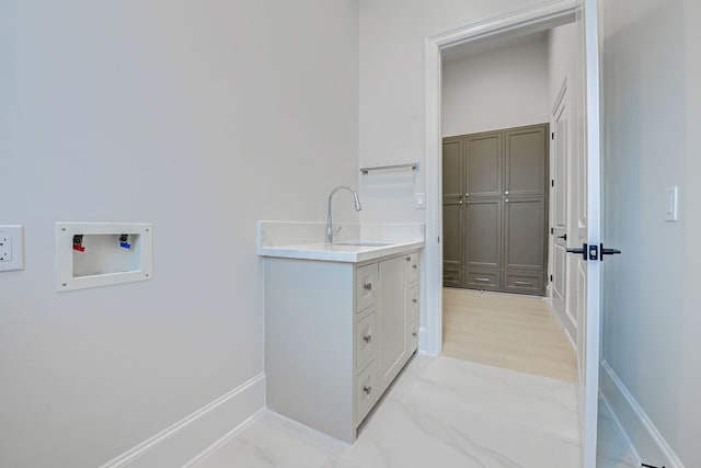 2822 Westgrove Ln, Houston, TX 77027 - laundry area with hookup for a washing machine and a sink