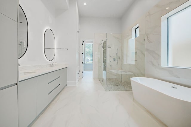 2822 Westgrove Ln, Houston, TX 77027 - bathroom with a marble finish shower, plenty of natural light, a freestanding bath, marble finish floors, and recessed lighting