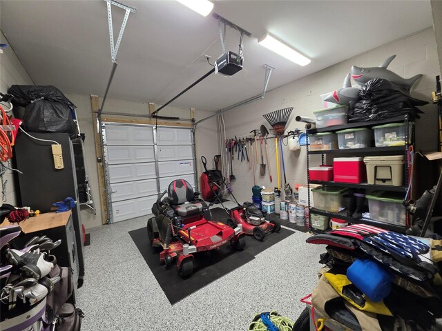 26804 Vista Meadow Ct, Huffman, TX 77336 - garage featuring a garage door opener and concrete block wall