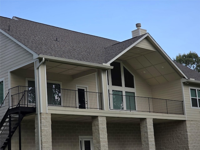 26804 Vista Meadow Ct, Huffman, TX 77336 - back of property with roof with shingles, a chimney, and a balcony