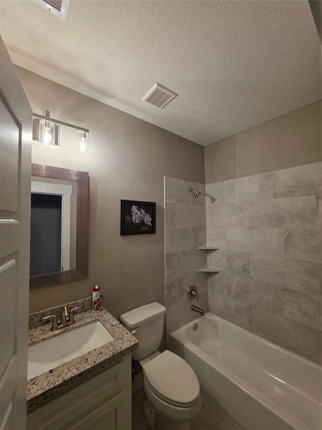 26804 Vista Meadow Ct, Huffman, TX 77336 - bathroom with vanity,  shower combination, and a textured ceiling