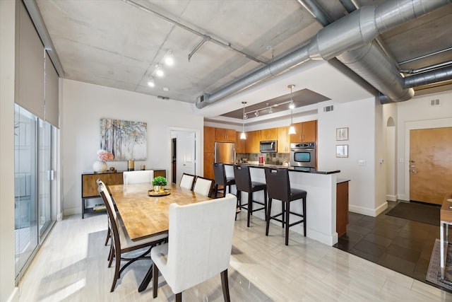 1901 Post Oak Blvd Unit 202, Houston, TX 77056 - dining space featuring arched walkways and rail lighting