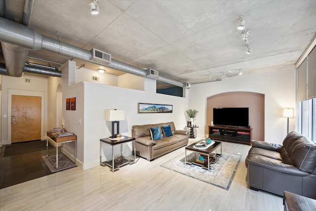 1901 Post Oak Blvd Unit 202, Houston, TX 77056 - living area featuring arched walkways, rail lighting, and wood finished floors