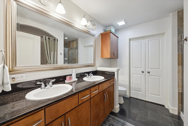 1901 Post Oak Blvd Unit 202, Houston, TX 77056 - bathroom with a tile shower and double vanity