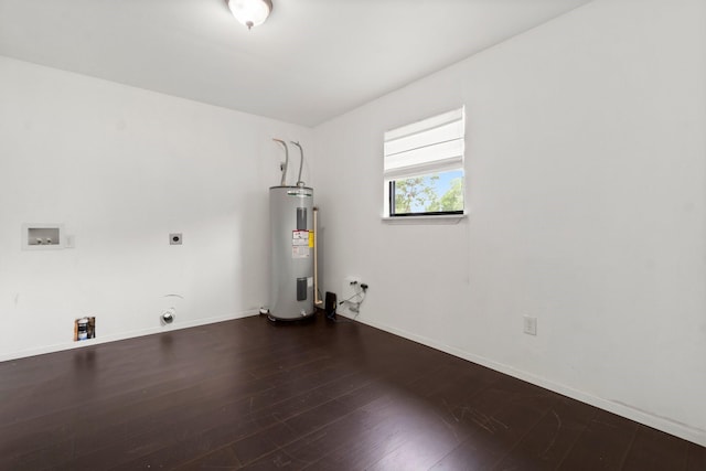 150 Lazy Ln, Livingston, TX 77351 - washroom with water heater, hookup for an electric dryer, dark wood finished floors, and hookup for a washing machine