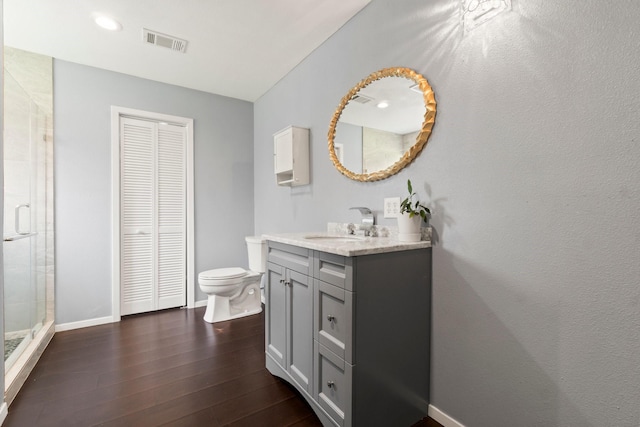 150 Lazy Ln, Livingston, TX 77351 - full bath with a closet, vanity, a stall shower, and wood finished floors