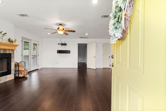 150 Lazy Ln, Livingston, TX 77351 - unfurnished living room featuring a glass covered fireplace, a ceiling fan, dark wood-style floors, and recessed lighting