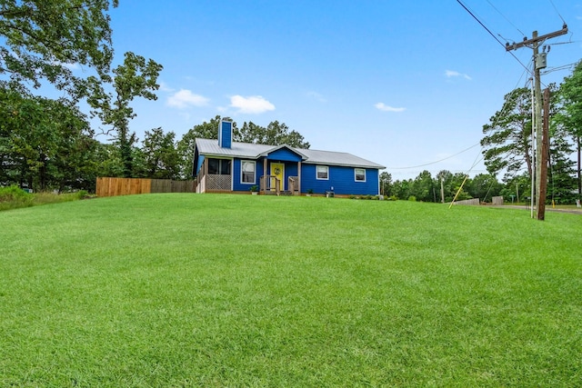 150 Lazy Ln, Livingston, TX 77351 - ranch-style home featuring a chimney and a metal roof
