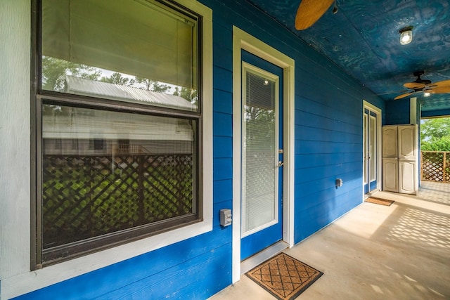 150 Lazy Ln, Livingston, TX 77351 - view of exterior entry with a ceiling fan and covered porch