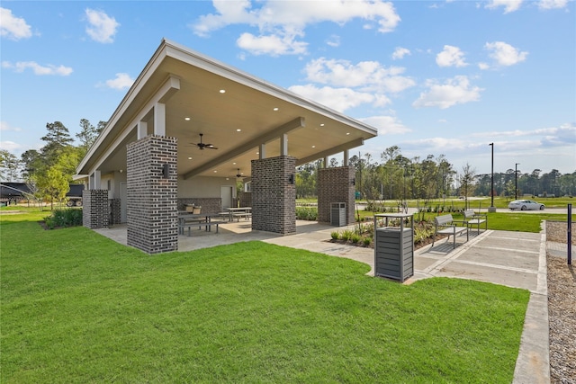 5407 Magnolia Heath Ln, Spring, TX 77373 - rear view of house with a patio area, a ceiling fan, a yard, and stucco siding