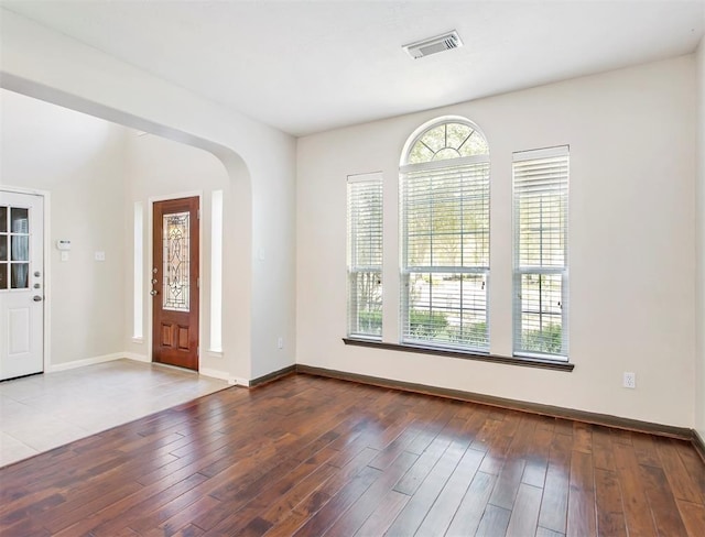 23931 Clover Trl, Katy, TX 77494 - entryway with arched walkways and hardwood / wood-style flooring