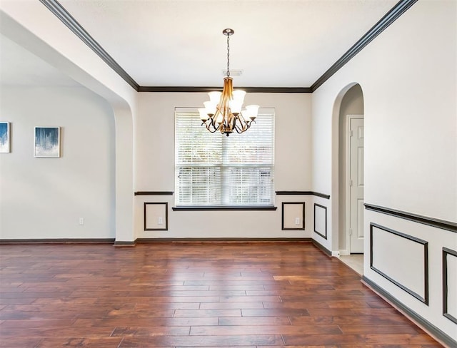 23931 Clover Trl, Katy, TX 77494 - unfurnished dining area featuring arched walkways, crown molding, a chandelier, and wood finished floors