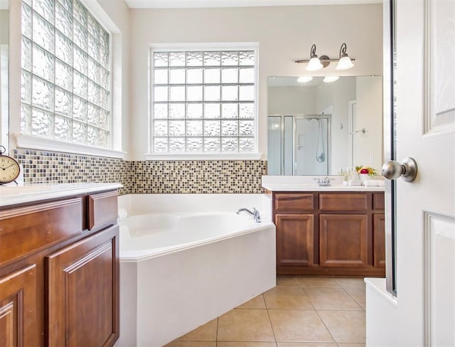 23931 Clover Trl, Katy, TX 77494 - bathroom with vanity, a shower stall, a bath, and tile patterned flooring