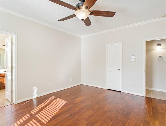 23931 Clover Trl, Katy, TX 77494 - unfurnished bedroom with crown molding, hardwood / wood-style floors, connected bathroom, and a ceiling fan