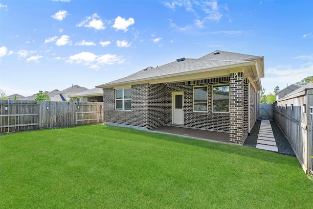 16833 Pink Wintergreen Dr, Conroe, TX 77385 - back of house with brick siding, a fenced backyard, and roof with shingles