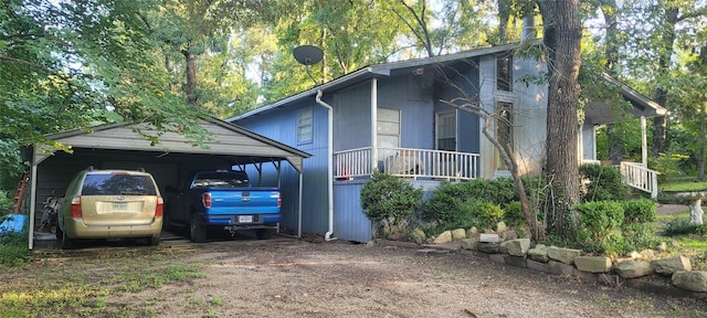20 Connor Ln, Huntsville, TX 77320 - view of property exterior featuring a carport and driveway