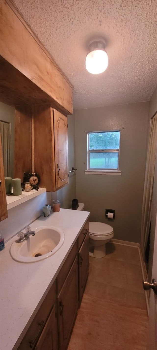 20 Connor Ln, Huntsville, TX 77320 - bathroom with a textured ceiling, vanity, and curtained shower