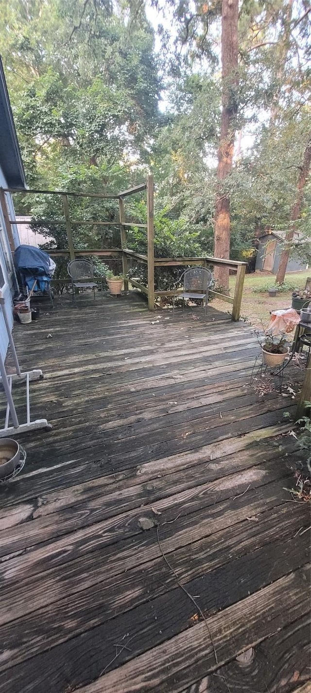 20 Connor Ln, Huntsville, TX 77320 - wooden terrace featuring grilling area and a storage shed