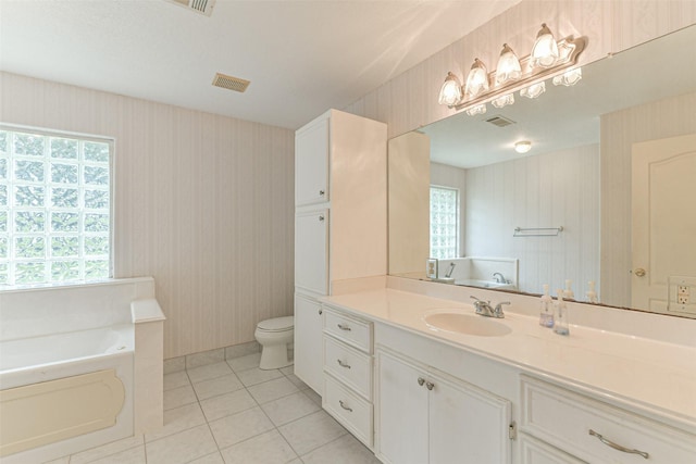 1628 Vauthier St, La Marque, TX 77568 - bathroom with a bath, vanity, tile patterned flooring, plenty of natural light, and wallpapered walls