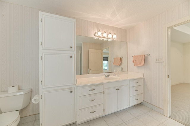 1628 Vauthier St, La Marque, TX 77568 - bathroom featuring wallpapered walls, vanity, tile patterned flooring, and a textured ceiling