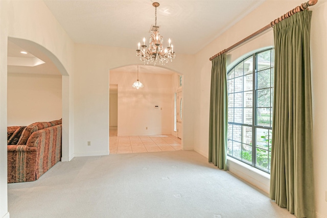 1628 Vauthier St, La Marque, TX 77568 - carpeted empty room featuring arched walkways and a chandelier