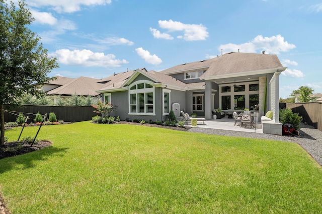 43 W Sawyer Ridge Dr, Spring, TX 77389 - rear view of house featuring a fenced backyard, stucco siding, a patio area, roof with shingles, and an outdoor hangout area