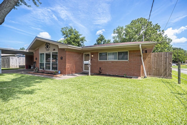 201 E 5th St, Deer Park, TX 77536 - single story home featuring brick siding and an attached carport