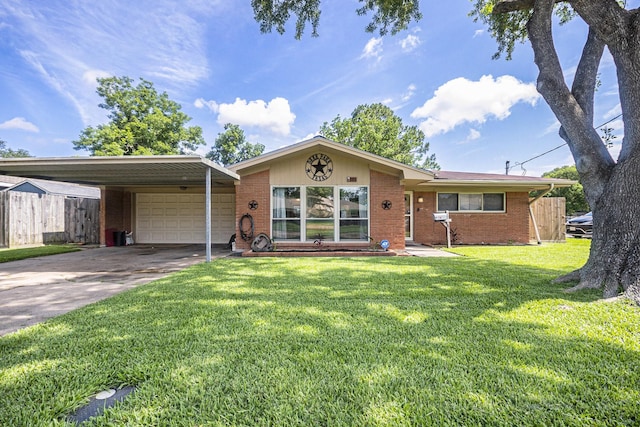 201 E 5th St, Deer Park, TX 77536 - single story home featuring an attached garage, brick siding, concrete driveway, and a carport