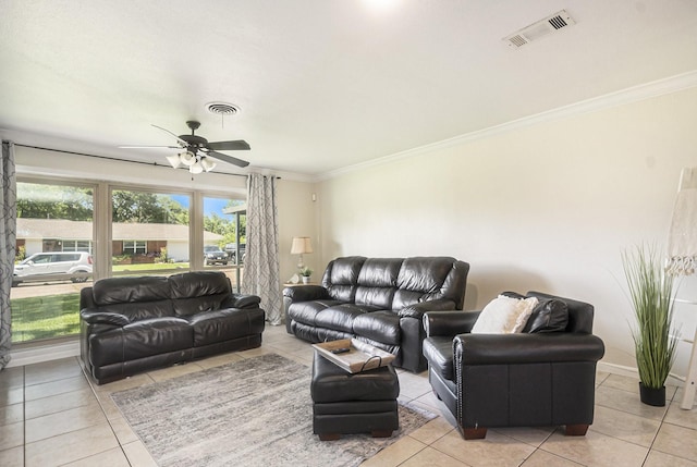 201 E 5th St, Deer Park, TX 77536 - living room with light tile patterned floors, crown molding, and a ceiling fan