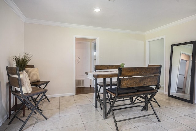 201 E 5th St, Deer Park, TX 77536 - dining room with ornamental molding and light tile patterned floors