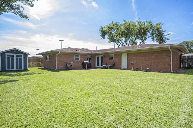 201 E 5th St, Deer Park, TX 77536 - rear view of property with french doors, a storage shed, and brick siding