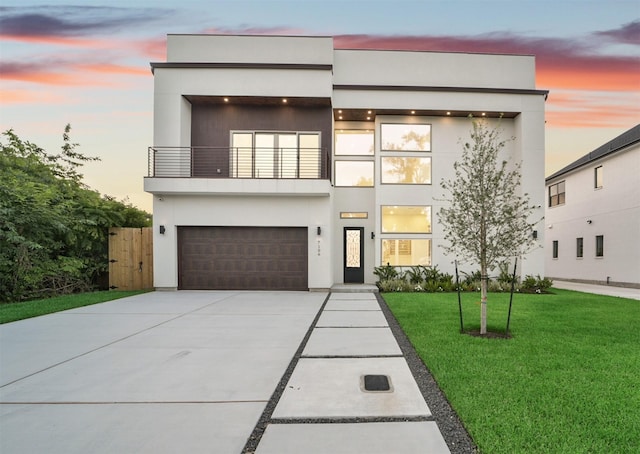 7106 Dearborn St, Houston, TX 77055 - contemporary house with a balcony, a front lawn, a garage, concrete driveway, and stucco siding