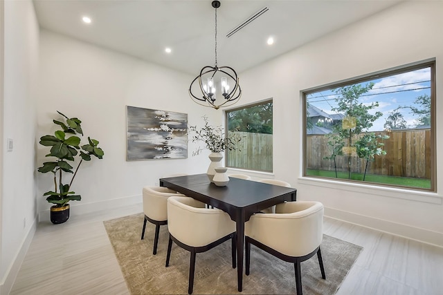 7106 Dearborn St, Houston, TX 77055 - dining space featuring a chandelier, recessed lighting, and wood finished floors
