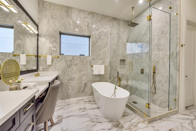 7106 Dearborn St, Houston, TX 77055 - full bathroom with marble tiled floors, a marble finish shower, vanity, and a soaking tub