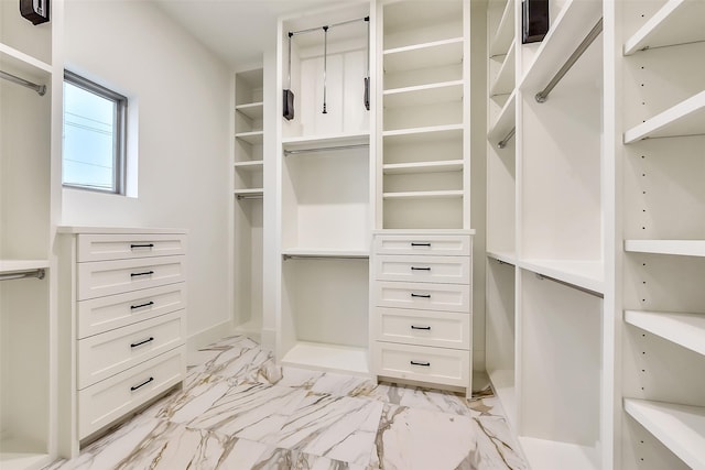 7106 Dearborn St, Houston, TX 77055 - spacious closet featuring light marble finish flooring