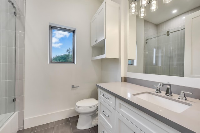 7106 Dearborn St, Houston, TX 77055 - bathroom featuring tile patterned floors, vanity, and combined bath / shower with glass door