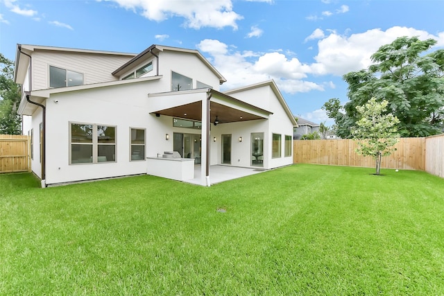 7106 Dearborn St, Houston, TX 77055 - back of house featuring ceiling fan, a fenced backyard, a patio, and stucco siding