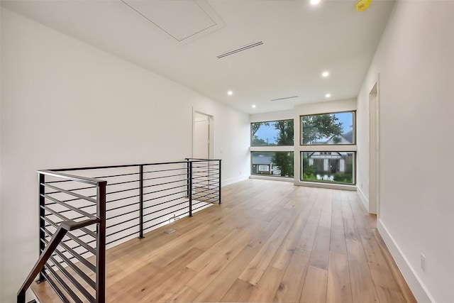 7106 Dearborn St, Houston, TX 77055 - hallway featuring an upstairs landing, hardwood / wood-style floors, recessed lighting, and attic access