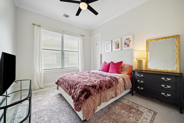 1207 W 24th St Unit A, Houston, TX 77008 - bedroom with carpet flooring, ornamental molding, and ceiling fan