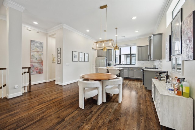1207 W 24th St Unit A, Houston, TX 77008 - dining space featuring dark wood-style floors, crown molding, and recessed lighting
