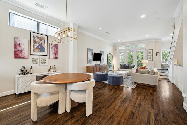 1207 W 24th St Unit A, Houston, TX 77008 - dining room featuring dark wood finished floors, ornamental molding, recessed lighting, and a chandelier